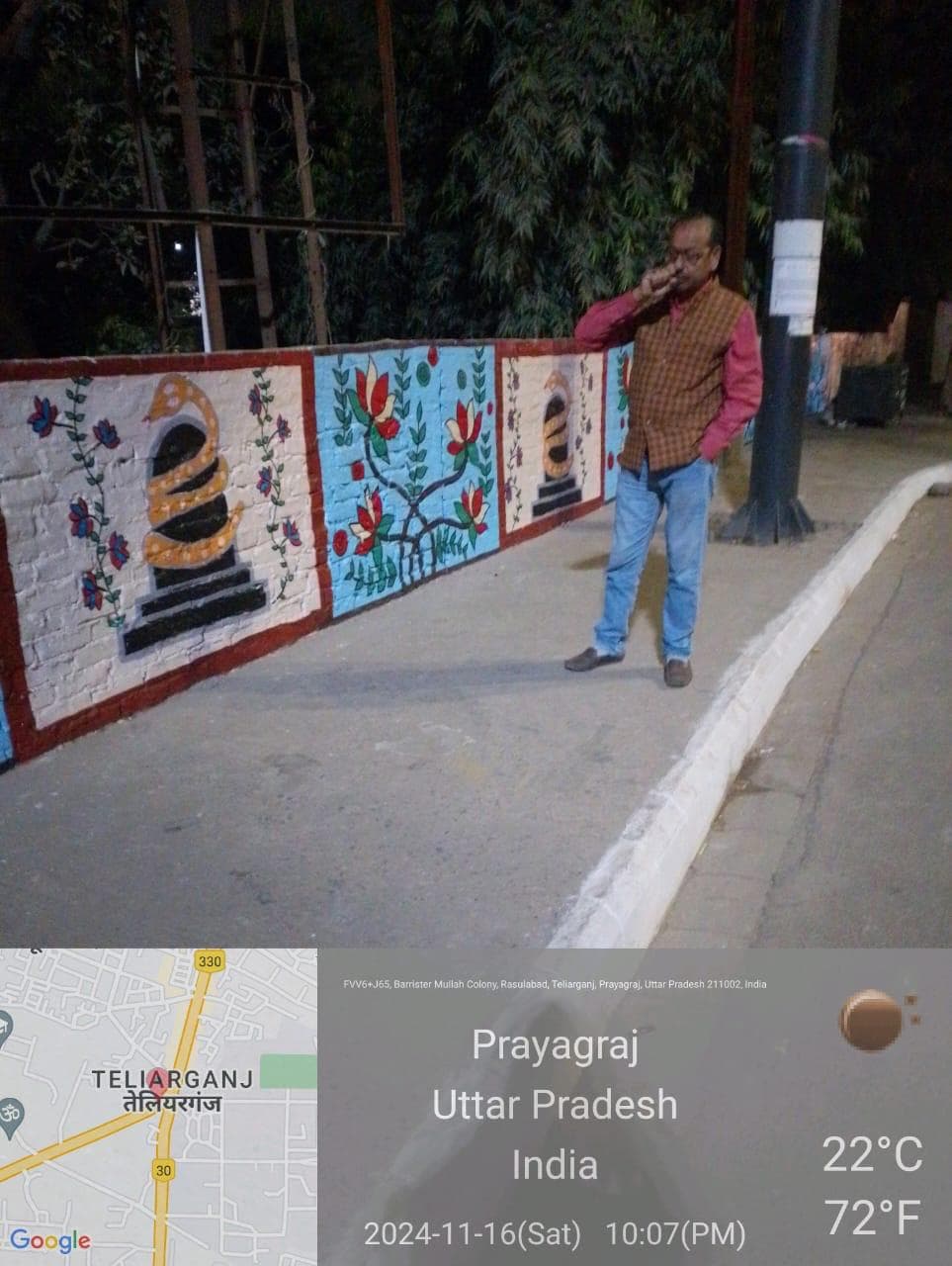 Installed folk art mural tiles on street wall